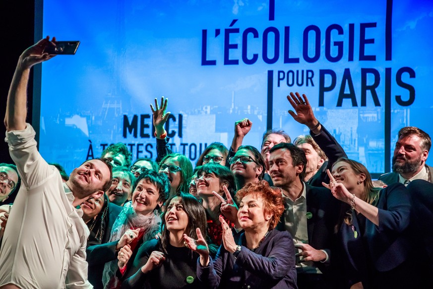 epa08196391 Ecologist Party, Europe Ecologie les Verts (EELV) candidate to the 2020 Paris mayoral elections David Belliard (L) takes a selfie picture with his party supporters during his campaign rall ...