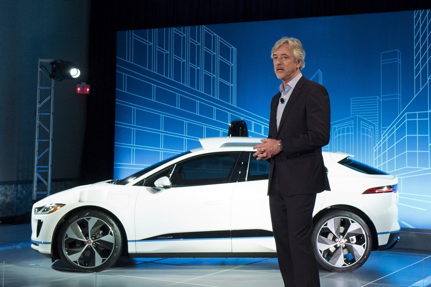 John Krafcik, the CEO of Waymo, stands with the Jaguar I-Pace vehicle, Tuesday, March 27, 2018, in New York. Self-driving car pioneer Waymo will buy up to 20,000 of the electric vehicles from Jaguar L ...