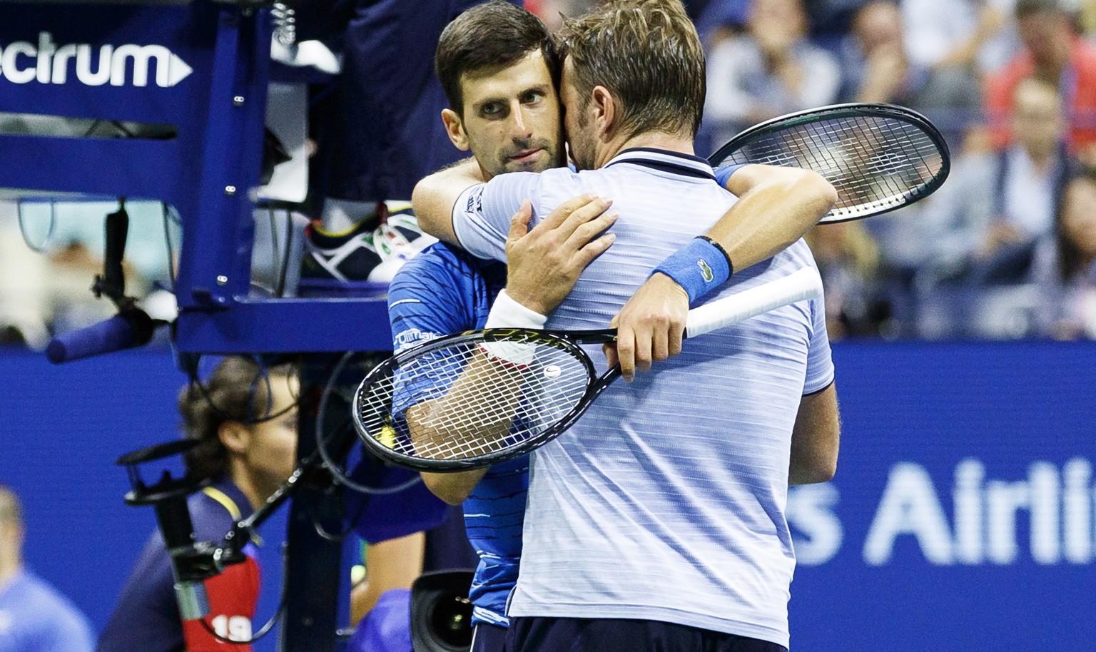 epa07811916 Novak Djokovic (L) of Serbia embraces Stan Wawrinka (R) of Switzerland after Djokovic retired in the third set during a match on the seventh day of the US Open Tennis Championships the UST ...
