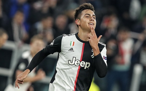 Juventus&#039; Paulo Dybala celebrates after scoring the opening goal during the Champions League group D soccer match between Juventus and Atletico Madrid at the Allianz stadium in Turin, Italy, Tues ...