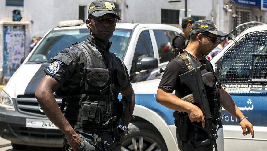 Tunisian police officers stand guard after an explosion in Tunis, Thursday June 27, 2019. Twin suicide attacks targeting security forces struck Tunisia&#039;s capital on Thursday, killing at least one ...