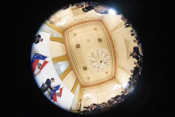 epa07592047 A picture taken with a fisheye lens shows Austrian Chancellor Sebastian Kurz speaking during a news conference ahead of the weekly cabinet meeting at the Austrian Chancellery building in V ...