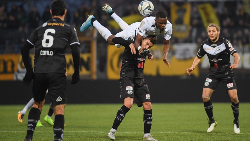 Lugano&#039;s player Olivier Custodio and Young Boys&#039; player Christopher Martins, from left, fight for the ball, during the Super League soccer match FC Lugano against BSC Young Boys, at the Corn ...