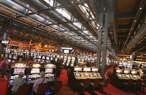 FILE - In this May 22, 2009, file photo, patrons play slot machines at the Sands Casino Resort Bethlehem in Bethlehem, Pa. Las Vegas Sands Corp. is selling its Bethlehem casino to Wind Creek Hospitali ...