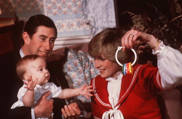 Princess Diana and Prince Charles are shown with their son Prince William during a photo session at Kensington Palace in London in December 1982. Britain s Princess Diana, who had been struggling to b ...