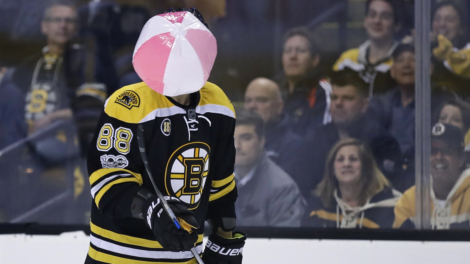 Boston Bruins left wing David Pastrnak juggles a beach ball which landed on the ice during the second period against the Ottawa Senators in Game 4 of a first-round NHL hockey playoff series in Boston, ...