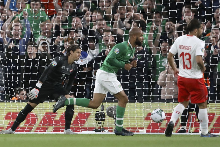Ireland&#039;s David McGoldrick, center, celebrates after scoring his side&#039;s first goal past Switzerland goalkeeper Yann Sommer, left, during the Euro 2020 group D qualifying soccer match between ...