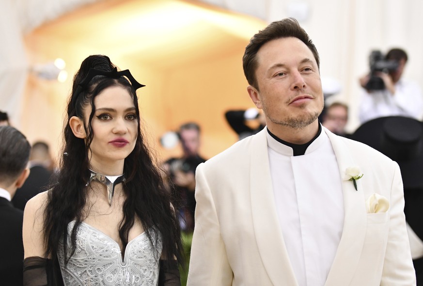 Grimes, left, and Elon Musk attend The Metropolitan Museum of Art&#039;s Costume Institute benefit gala celebrating the opening of the Heavenly Bodies: Fashion and the Catholic Imagination exhibition  ...