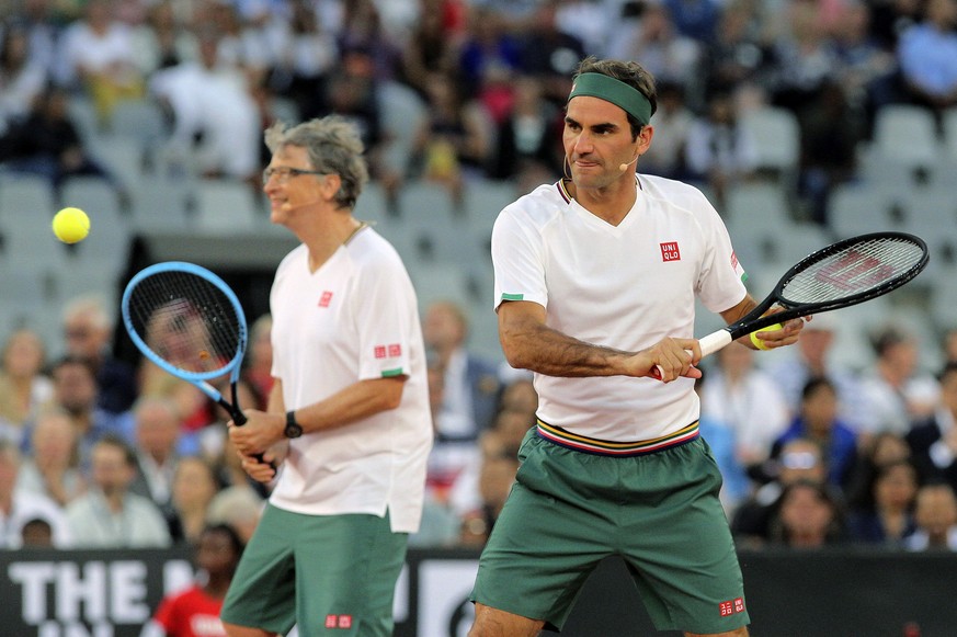 Roger Federer and Bill Gates take on Rafael Nadal and Trevor Noah in the exhibition match held at the Cape Town Stadium in Cape Town, South Africa, Friday Feb. 7, 2020. (AP Photo/Halden Krog)