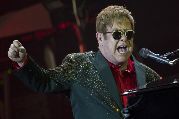 FILE - In this Monday, May 30, 2016, file photo, musician Elton John performs at his concert in the Crocus City Hall outside Moscow, Russia. John, Britney Spears, Alicia Keys and Calvin Harris are amo ...
