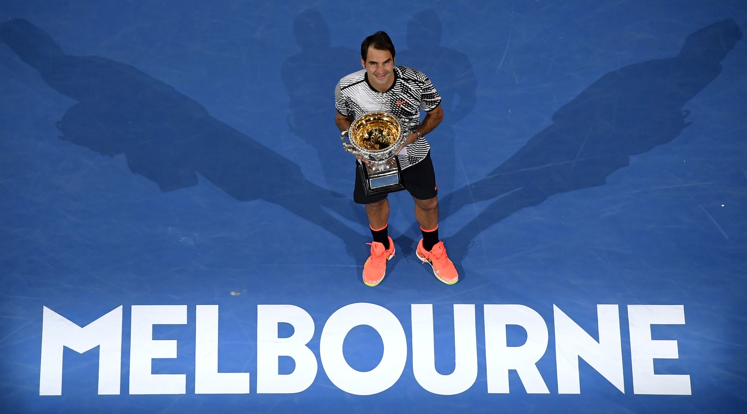 FILE - In this Jan. 29, 2017, file photo, Switzerland&#039;s Roger Federer poses with his trophy after defeating Spain&#039;s Rafael Nadal in the men&#039;s singles final at the Australian Open tennis ...