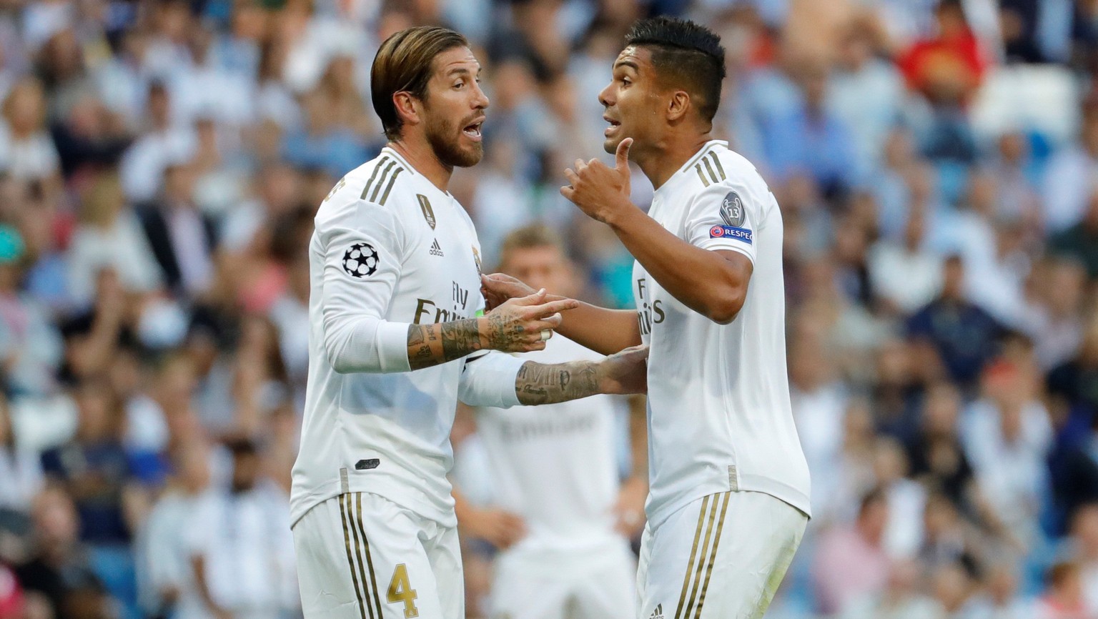 epaselect epa07886558 Real Madrid&#039;s defender Sergio Ramos (L) and Carlos Henrique Casemiro react during the UEFA Champions League group A match between Real Madrid and Club Brugge at Santiago Ber ...