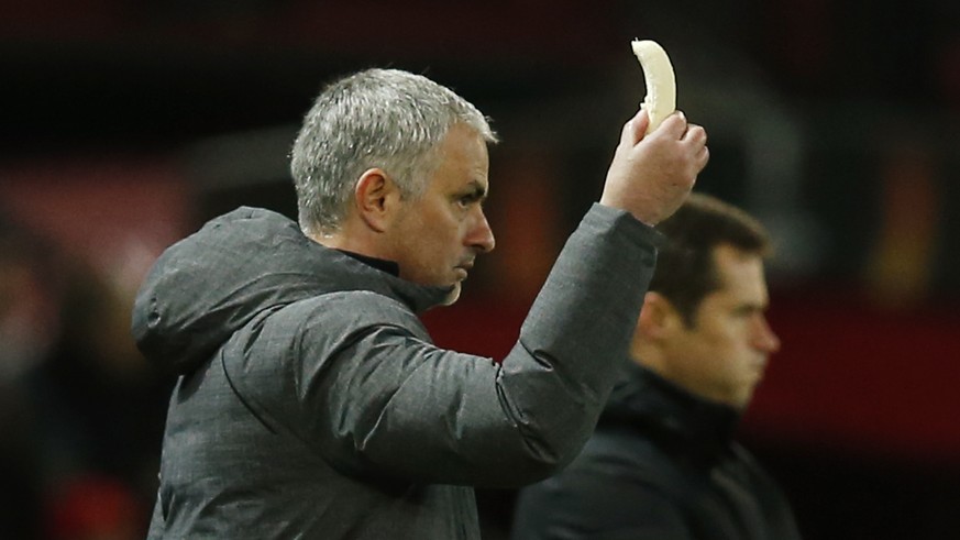 Britain Football Soccer - Manchester United v FC Rostov - Europa League Round of 16 Second Leg - Old Trafford, Manchester, England - 16/3/17 Manchester United manager Jose Mourinho holds a banana whic ...