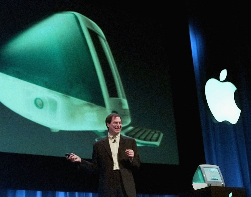 Apple Computers Inc. interim chief executive Steve Jobs unveils the new iMac computer in Cupertino, Calif., Wednesday, May 6, 1998. The price of the new consumer model iMac is $1,299 and will be avail ...