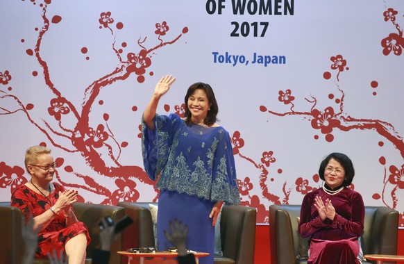 Philippine Vice President Leni Robredo, center, waves at the opening ceremony of the Global Summit of Women in Tokyo, Thursday, May 11, 2017. Over 1,000 business leaders and government officials from  ...