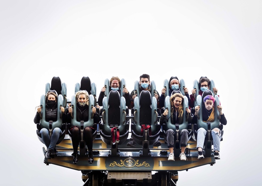 epaselect epa08789562 Visitors sit in a leisure ride in Efteling amusement park in Kaatsheuvel, Netherlands, 31 October 2020. Due to the coronavirus pandemic, tickets must be purchased through a reser ...