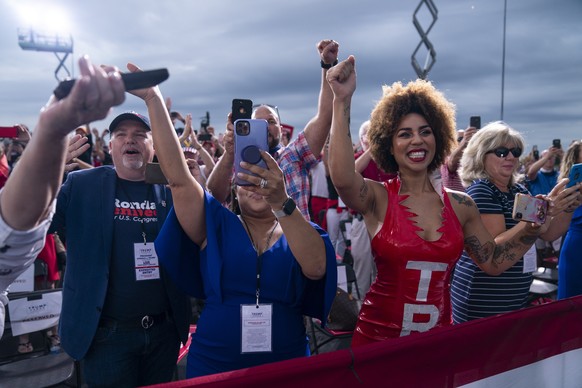 Supporters of President Donald Trump cheer as he arrives to speak at a campaign rally at Smith Reynolds Airport, Tuesday, Sept. 8, 2020, in Winston-Salem, N.C. (AP Photo/Evan Vucci)
Donald Trump