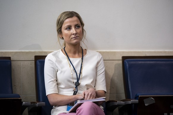 epa08535529 Sarah Matthews, White House deputy press secretary, listens during a news conference in the James S. Brady Press Briefing Room at the White House in Washington, DC, USA, 08 July 2020. EPA/ ...
