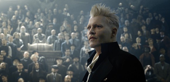 This image released by Warner Bros. Pictures shows Johnny Depp in a scene from &quot;Fantastic Beasts: The Crimes of Grindelwald.&quot; (Warner Bros. Pictures via AP)