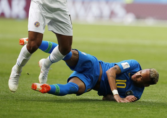 Brazil&#039;s Neymar falls as he tangles in the legs of Costa Rica&#039;s Johan Venegas during the group E match between Brazil and Costa Rica at the 2018 soccer World Cup in the St. Petersburg Stadiu ...