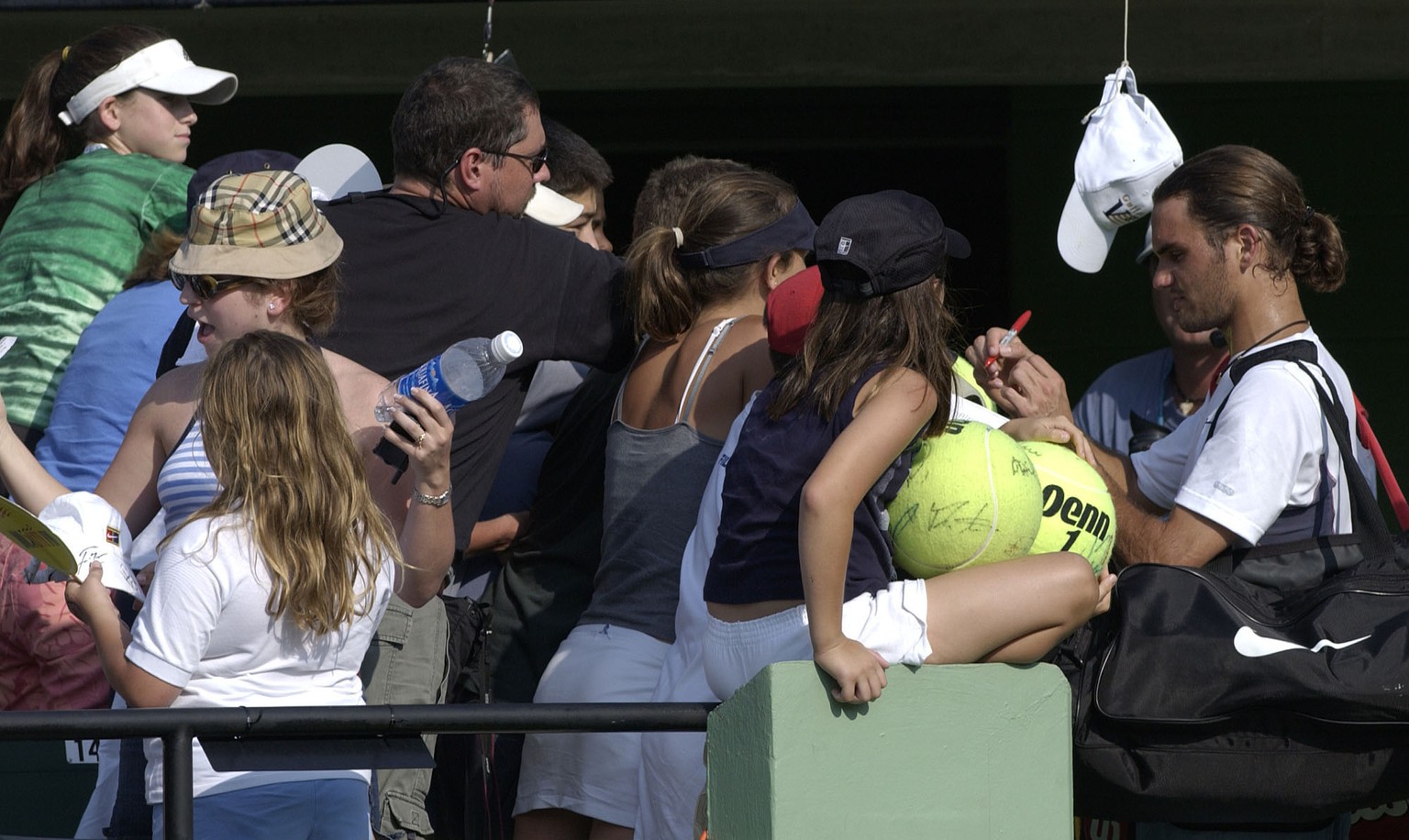 28 Mar 2002: Roger Federer of Switzerland signs autographs after defeating Andrei Pavel of Romania during the Nasdaq-100 Open at The Tennis Center at Crandon Park in Miami, Florida. DIGITAL IMAGE Mand ...