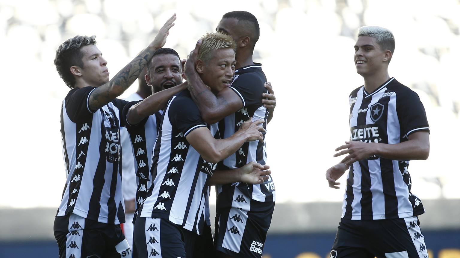 Botafogo&#039;s Keisuke Honda, of Japan, is greeted by teammates after scoring from the penalty spot his side&#039;s opening goal against Bangu during a Carioca Championship soccer match in Rio de Jan ...