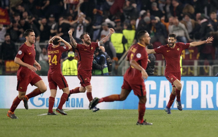 Roma players celebrate after Kostas Manolas scored his side&#039;s 3rd goal during the Champions League quarterfinal second leg soccer match between Roma and FC Barcelona at Rome&#039;s Olympic Stadiu ...