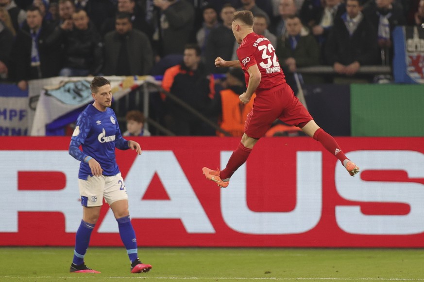 epa08267825 Joshua Kimmich (R) of Bayern Munich celebrates scoring the opening goal during the German DFB Cup quarter final match between Schalke 04 and Bayern Munich in Gelsenkirchen, 03 March 2020.  ...