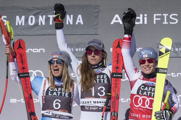 epa07389848 (L-R) Joana Haehlen of Switzerland, Sofia Goggia of Italy and Nicole Schmidhofer of Austria react after the Women&#039;s Downhill race of the FIS Alpine Ski World Cup event in Crans-Montan ...