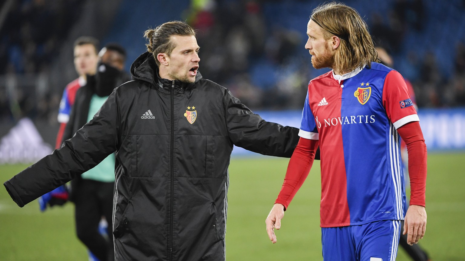 Basel&#039;s Valentin Stocker, left, and Michael Lang show dejection after the UEFA Champions League round of sixteen first leg soccer match between Switzerland&#039;s FC Basel 1893 and England&#039;s ...