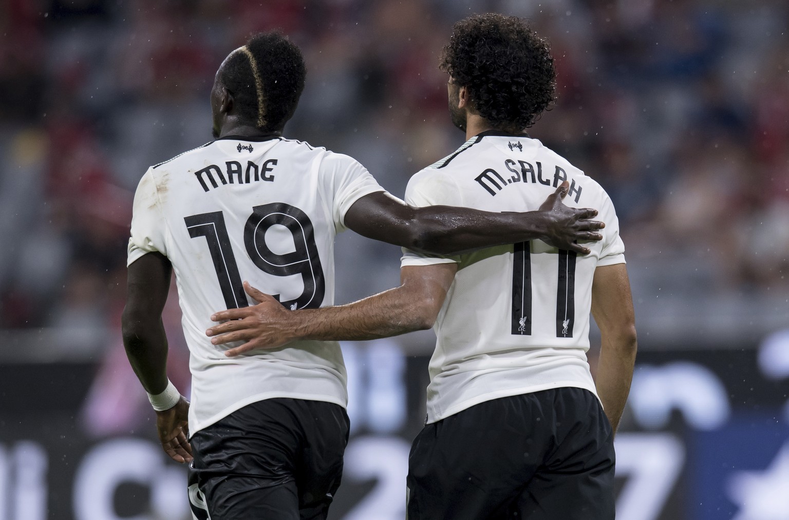 Liverpool&#039;s Mohamed Salah, right, celebrates with teammate Sadio Mane after scoring during the Audi Cup semifinal soccer match between FC Bayern Munich and Liverpool FC in the Allianz Arena in Mu ...