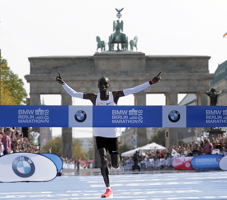 Eliud Kipchoge runs to win the 45th Berlin Marathon in Berlin, Germany, Sunday, Sept. 16, 2018. Eliud Kipchoge set a new world record in 2 hours 1 minute 40 seconds. (AP Photo/Michael Sohn)