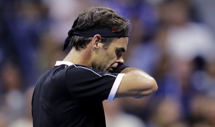Roger Federer, of Switzerland, reacts after missing a point during the fifth set against Grigor Dimitrov, of Bulgaria, during the quarterfinals of the U.S. Open tennis tournament Tuesday, Sept. 3, 201 ...