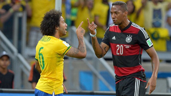 epa04306325 Germany&#039;s Jerome Boateng (R) in action against Brazil&#039;s Marcelo (L) during the FIFA World Cup 2014 semi final match between Brazil and Germany at the Estadio Mineirao in Belo Hor ...