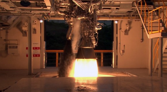 epa05352532 A handout picture made available by the Korea Aerospace Research Institute (KARI) on 09 June 2016 shows the scene of a 75-ton liquid-fuel rocket engine test firing conducted at the Naro Sp ...