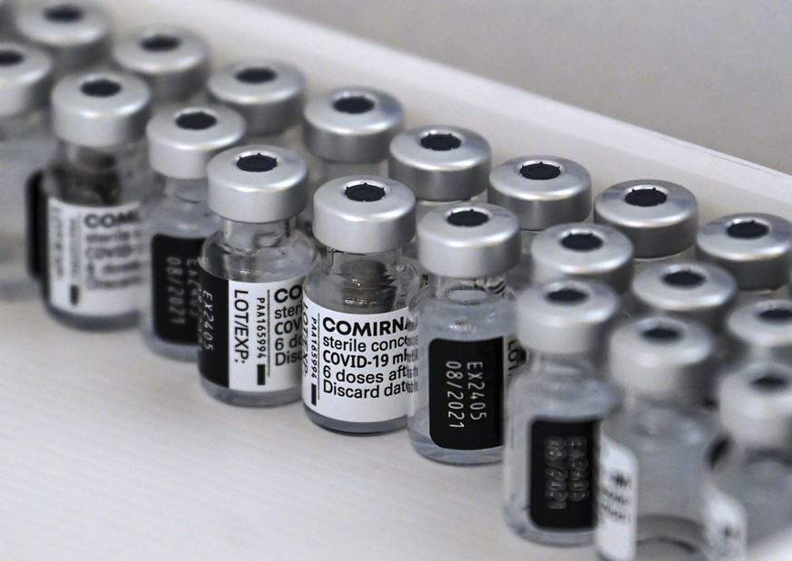 epa09154598 Empty bottles of of Pfizer-BioNTech COVID-19 vaccine seen in the box during the vaccination at the Arena &#039;Boris Trajkoovski&#039; in Skopje, Republic of North Macedonia, 23 April 2021 ...
