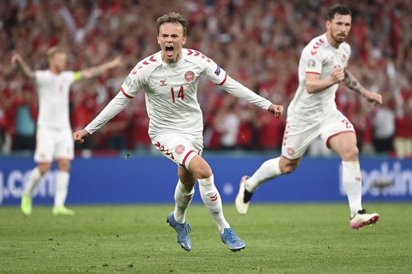 Denmark&#039;s Mikkel Damsgaard celebrates after scoring his side&#039;s opening goal during the Euro 2020 soccer championship group B match between Russia and Denmark at the Parken stadium in Copenha ...