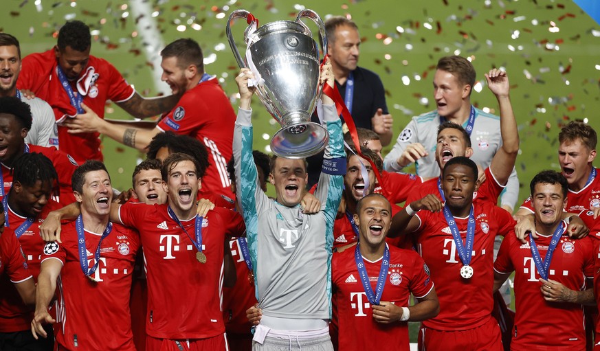 Bayern&#039;s goalkeeper Manuel Neuer lifts the trophy after Munich won the Champions League final soccer match between Paris Saint-Germain and Bayern Munich at the Luz stadium in Lisbon, Portugal, Su ...