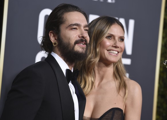 Tom Kaulitz, left, and Heidi Klum arrive at the 76th annual Golden Globe Awards at the Beverly Hilton Hotel on Sunday, Jan. 6, 2019, in Beverly Hills, Calif. (Photo by Jordan Strauss/Invision/AP)