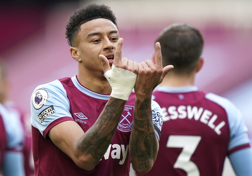 epa09128779 Jesse Lingard of West Ham United celebrates after scoring the opening goal during the English Premier League match between West Ham United and Leicester City in London, Britain, 11 April 2 ...