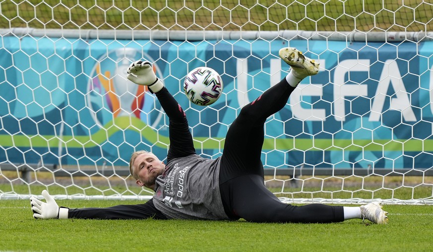 Denmark&#039;s goalkeeper Kasper Schmeichel exercises at the training ground during a training session of Denmark&#039;s national team in Helsingor, Denmark, Monday, June 14, 2021. It is the first tra ...