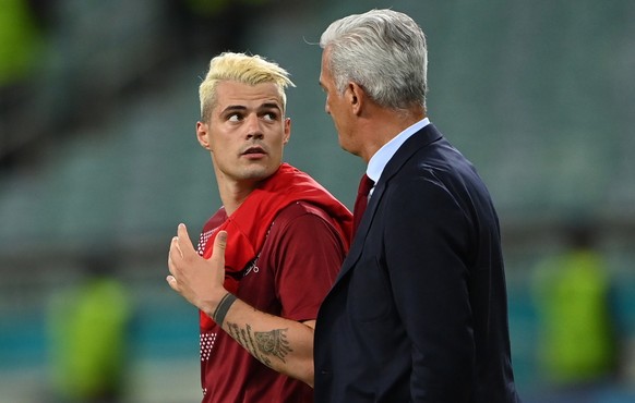 epa09289163 Granit Xhaka of Switzerland and Switzerland&#039;s head coach Vladimir Petkovic (R) react after the UEFA EURO 2020 group A preliminary round soccer match between Switzerland and Turkey in  ...