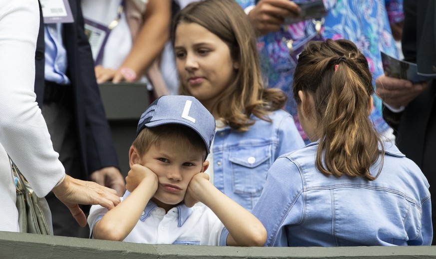 Roger Federer?s children sit in the box during Federer?s first round match against Lloyd Harris of South Africa, at the All England Lawn Tennis Championships in Wimbledon, London, on Tuesday, July 2,  ...