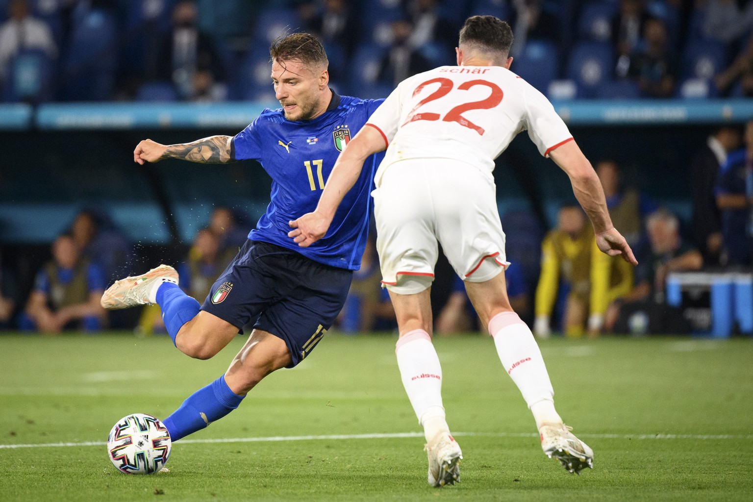 epa09277956 Italy&#039;s forward Ciro Immobile (L) in action against Switzerland&#039;s defender Fabian Schaer during the UEFA EURO 2020 group A preliminary round soccer match between Italy and Switze ...