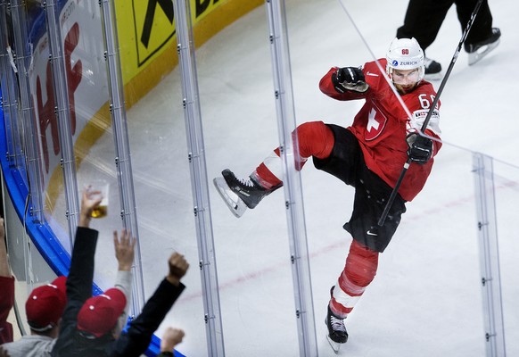 Tristan Scherwey of Switzerland scores the first goal during the IIHF World Championship semi-final ice hockey match between Canada and Switzerland in Royal Arena in Copenhagen, Denmark, Saturday, May ...