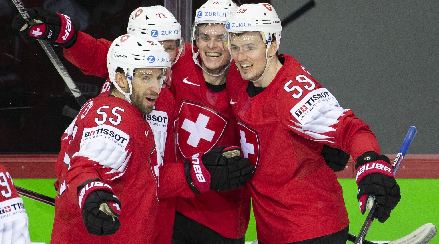 Switzerland&#039;s forward Gregory Hofmann, 2nd right, celebrates his goal with teammates defender Romain Loeffel #55, forward Enzo Corvi #71 and forward Dario Simion, right, after scoring the 4:0 dur ...