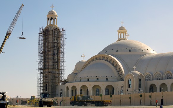 epa07264388 (FILE) - Laborers work outside the newly-constructed Coptic Nativity of the Christ Cathedral at the new administrative capital, yet-unnamed, 45km east of Cairo, Egypt, 03 January 2019 (rei ...