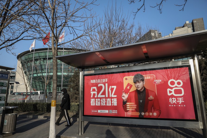 epa08981084 A Kauishou&#039;s billboard is seen outside Kuaishou headquarters in Beijing, China, 02 February 2021. Chinese mainland short-video platform Kuaishou Technology intends to offer 365.2 mill ...