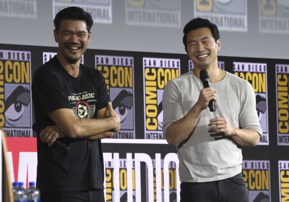 Destin Daniel Cretton, left, and Simu Liu speaks during the &quot;Shang-Chi and The Legend of the Ten Rings&quot; portion of the Marvel Studios panel on day three of Comic-Con International on Saturda ...