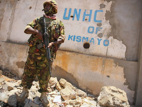 epa03423143 A handout photo released by the African Union-United Nations Information Support Team AU-UN IST on 06 October 2012 shows a soldier serving with the Kenyan Contingent of the African Union M ...